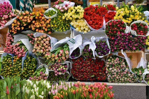 Beautiful assortment of colorful tulip bouquets on display at an outdoor flower market.